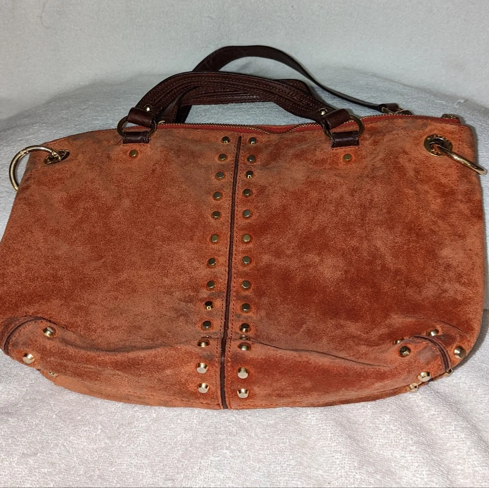 Michael Kors orange suede studded slouchy shoulder bag.